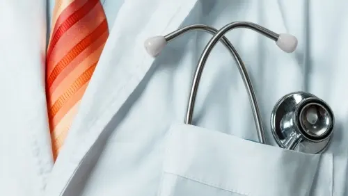 Doctor representing EWORLD’s design and implementation of next-gen Palo Alto Network Security and HPE Aruba Instant-On for a healthcare provider.